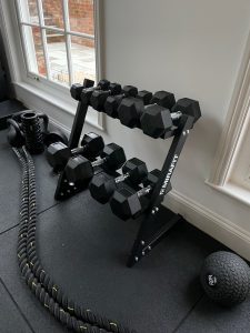 Customers Mirafit Dumbbell Set & Weight Rack in a home gym