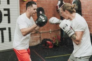 Two people sparring - a form of boxing training that can get you ripped and toned
