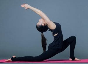 Lady doing solo Pilates - we will be covering solo Pilates in our blog