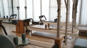 Pilates Reformer in a Studio - A Pilates Reformer is a type of Pilates Machine used at home and in the professional pilates studio